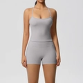 Close-up of grey high-stretch yoga set with spaghetti strap top and high-waist biker shorts - S / Top And Bottom / Frost Grey