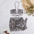 Detailed flat lay of a zebra print three-piece bikini set with a drawstring beach skirt - S / Light Coffee