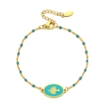 Nahaufnahme der goldenen Edelstahlkette mit blauen Perlen und Lebensbaum-Anhänger - Hellblau (XN122-LBLUE)