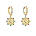 Detail of gold hoop earrings with starburst pendant and multicolor zircon stones - Gold Color Stone Badge