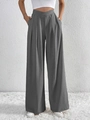 Detail of grey wide-leg trousers featuring a pleated texture and stylish V-shape waistline - S / Gray