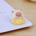 Cute white resin cat figurine holding a yellow paw-print pillow for desk decor - Mini Relaxing Cat 001D
