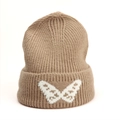 Close-up of brown knit beanie featuring a white butterfly jacquard and ribbed texture - One Size (Elastic) / Khaki
