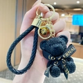 Black resin knitted bear keychain with golden bell and leather strap for bags - Sitting Knit Resin Bear-Black