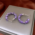 Detailed view of silver hoop earrings featuring geometric purple zircon stones on display - Purple Geometric Faceted Hoop Style (33#)