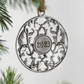 Close-up of vintage metal Christmas ornament with 2023 engraving on a tree - Year 2023
