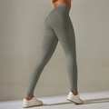 Detailed back view of high-waisted seamless gray yoga leggings showing peach butt lift effect - Dark Gray
