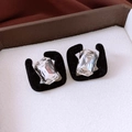 Macro shot of French style square studs with black velvet frame and clear zircon stone - Silver Earring Post-Black