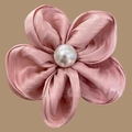 Pink satin flower hair scrunchie with a large central pearl on a brown background - Pink Hair Clip