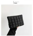 Detail of black quilted puffer bag showing square pattern and soft cotton texture - Black