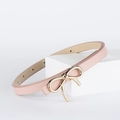 Pink slim PU leather belt for women featuring a golden metal bow buckle on a white stand - Pink