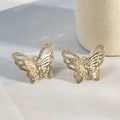 Macro detail of gold-plated butterfly earrings with layered mesh hollow wing design - Double Layer Hollow Style / Gold
