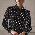 Detailed view of polka dot shirt fabric with lapel collar and classic buttoned cuffs - S / Black