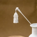 Macro shot of silver tassel hairpin with hollow geometry in a white ceramic vase - Classic Zen Tassel (F367)