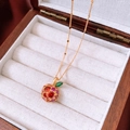 Macro detail of 14k gold plated apple pendant with red and purple zircons in a jewelry box - Zircon Apple Pendant / Necklace-Gold-Real Gold Plated