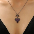 Gothic Y2K necklace featuring a purple heart pendant with a bow and cross detail - Purple