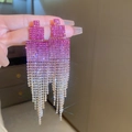 Close-up of long tassel earrings with pink gradient rhinestones and silver fringe - Silver Pin - Rose Red Gradient Tassel Earrings