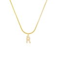 Detail of gold snake chain necklace with sparkling rhinestone initial R pendant - Letter R