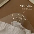 Macro view of 20pcs 5x5.5mm gold alloy mini bowknot nail art charms for DIY decoration - XY-547 Mini Bowknot Style 2 5x5.5mm Gold