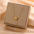 Elegant gold-tone titanium steel lariat necklace featuring polished bead pendants - Polished Round Bead Y-Necklace (8221)