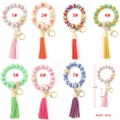 Silicone bead keychain bracelet set with beech wood, leather tassel, and alloy clasp - Custom Development