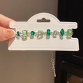 Detailed close-up of a French style silver bracelet with multi-shape green zircon crystals - 12# Bracelet - Silver - Light Green