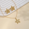 Golden starfish necklace and earrings set with hammered texture on beige background - Starfish Hammered Style (E5752)