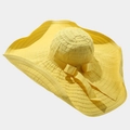 Detail of the yellow sun hat with large wavy brim and elegant ribbon bow decoration - One Size / Bow Yellow