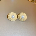 Macro shot of gold spiral disc earrings with centered white pearl in vintage style - 34# Gold Spiral Disk Pearl (Silver Earring Post)