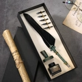 Gothic black feather pen set with green embossed metal barrel and ink bottle holder - Black