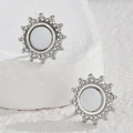 Minimalist silver sunburst stud earrings in stainless steel on white stone background - Sunburst Style (JZE845-01)
