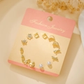 Golden titanium steel stud earrings set featuring 12 pieces with pearls and crystals - Gold Bowknot Pin (E1923-1)