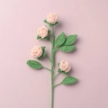 Detail of a handmade pink crochet rose bouquet with green leaves on pink background - Finished Bubble Rose (4 Heads Skin Tone)