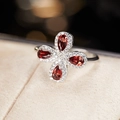 Macro shot of S925 silver ring featuring a four-leaf clover design with red garnets - Natural Garnet Four-Leaf Clover Ring LR256