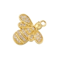 Macro shot of gold-toned bee pendant with sparkling zircon inlays for jewelry making - Bee - Gold - with Zircon