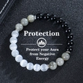 8mm moonstone and obsidian beaded elastic bracelet with silver spacers on leather - Triple Protection