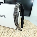 Detailed close-up of a braided black headband with shimmering rhinestones and cross texture - Mineral Grey Rhinestone