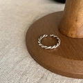 Adjustable silver twist rope ring with minimalist metallic finish on wooden display - Twisted Rope Texture Open Ring (J030)