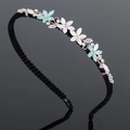 Serre-tête ondulé noir avec des fleurs dorées et des strass blancs et bleus - Fleur à cinq feuilles-Bleu