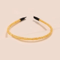 Close-up of golden glitter headband with shiny sequins and black protective tips - Ginger Yellow