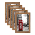 Detail view of five natural wood frames set with iconic red telephone booth art prints - Beech Color 6 Inch