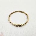 Detail view of handmade gold beaded bracelet with polished stainless steel beads on fabric - Gold Gradient Beads 8mm (YB-1012G-8mm)