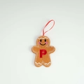Felt gingerbread man ornament with embroidered red letter P and hanging ribbon - Letter P