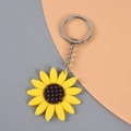 Portachiavi girasole in PVC giallo con centro a scacchi marrone e anello argento - Girasole
