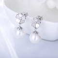 Elegant S925 silver flower earrings with sparkling zircons and white pearls set on ceramic - 925 Silver / White