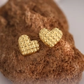 Macro shot of gold heart earrings with rhombus pattern on dark natural stone background - EH140-Rhombohedral Heart