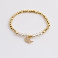 Elastic beaded dolphin bracelet with gold copper beads and white pearls for women - Gold/White