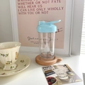 Portable plastic water bottle with flip top and blue lid on a wooden tray - 401-500ml / Blue