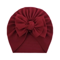 Soft burgundy waffle knit baby turban hat featuring a large decorative bow - One Size / Burgundy