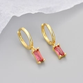 Detail shot of golden huggie earrings showing the 925 silver hallmark and red zircon - Copper / Gold / Rose Red Zircon